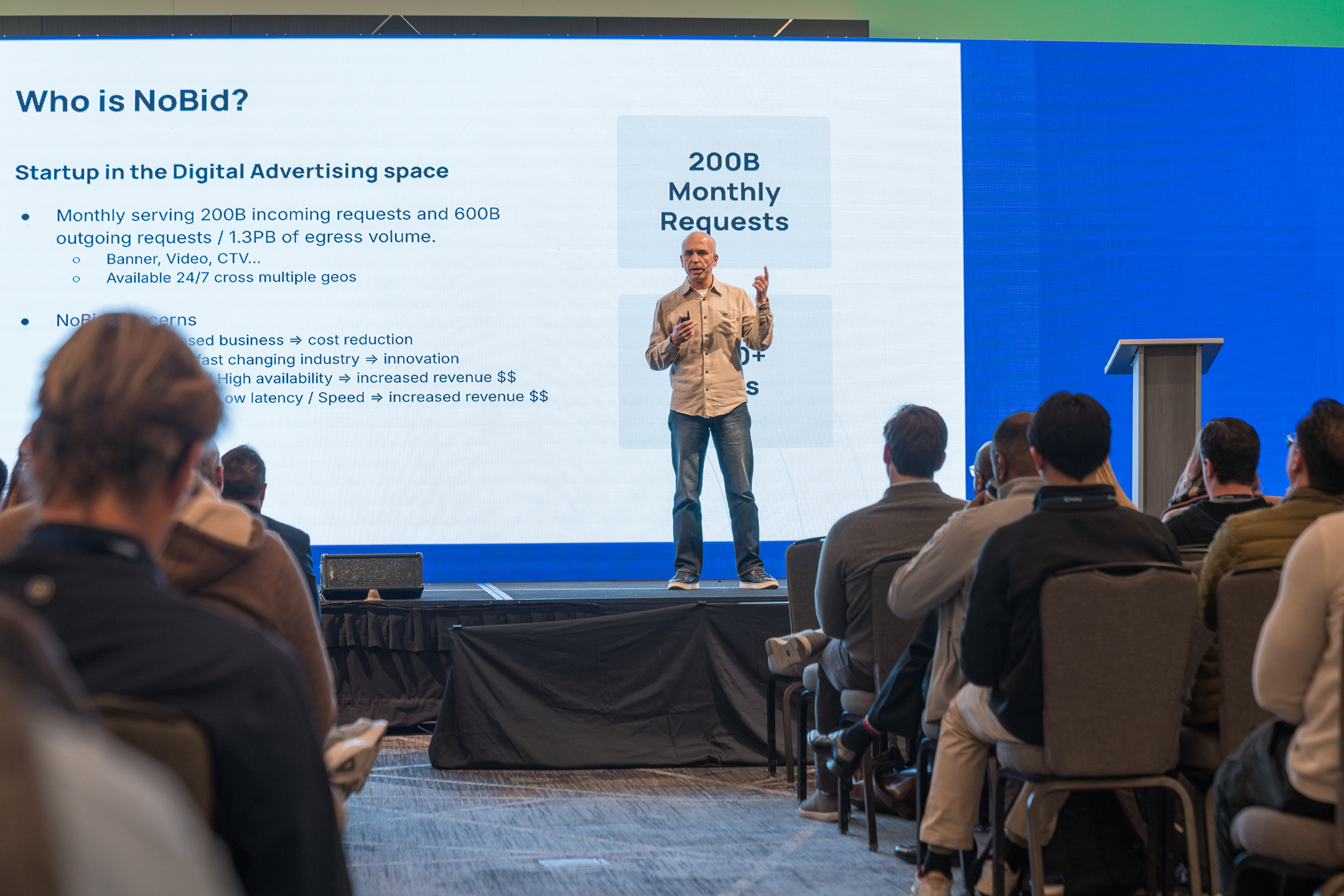 Reda Guermas presenting on stage at Deploy