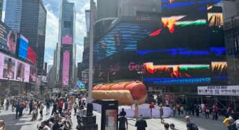 A giant, confetti-shooting hot dog is now on view in Times Square